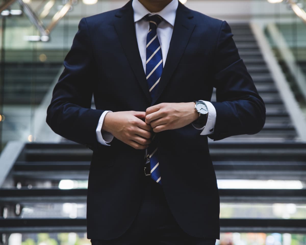 Elegant cityscape of Copenhagen reflected in the window of a luxury sedan.