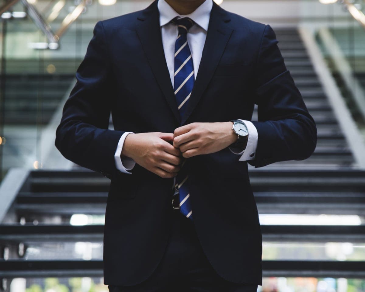 Elegant cityscape of Copenhagen reflected in the window of a luxury sedan.